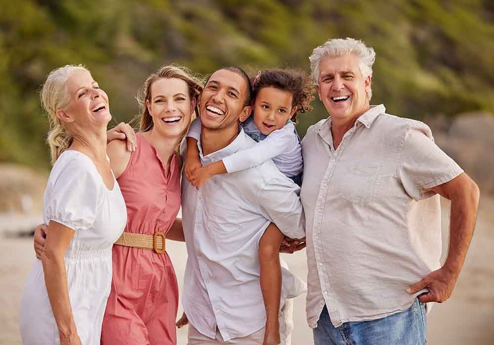 Happy family smiling with confidence after dental implants
